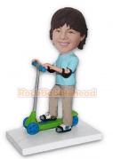 Boy with Elbow Pads Riding a Scooter Bobblehead