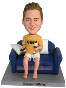 Relax Man Holding Bear and TV Remote Control Bobblehead